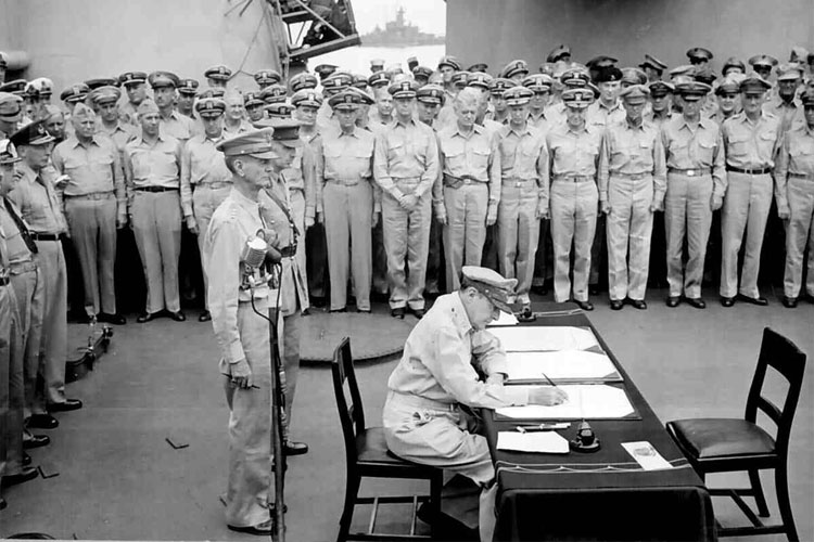 MacArthur signs Japanese Surrender