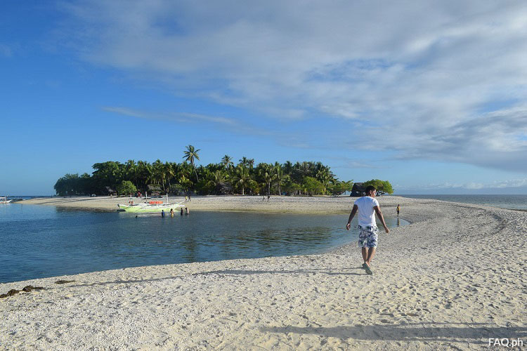 Walking on the sandbar Digyo Island